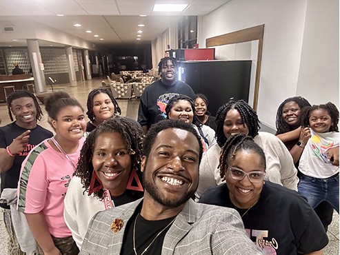 Several people posing for a photograph