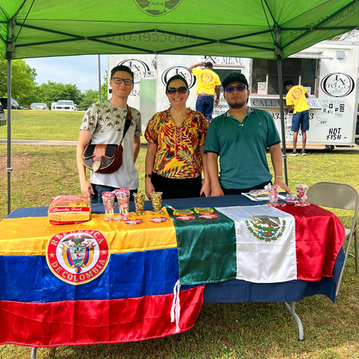 Volunteers behind the LatinX Cultural Table