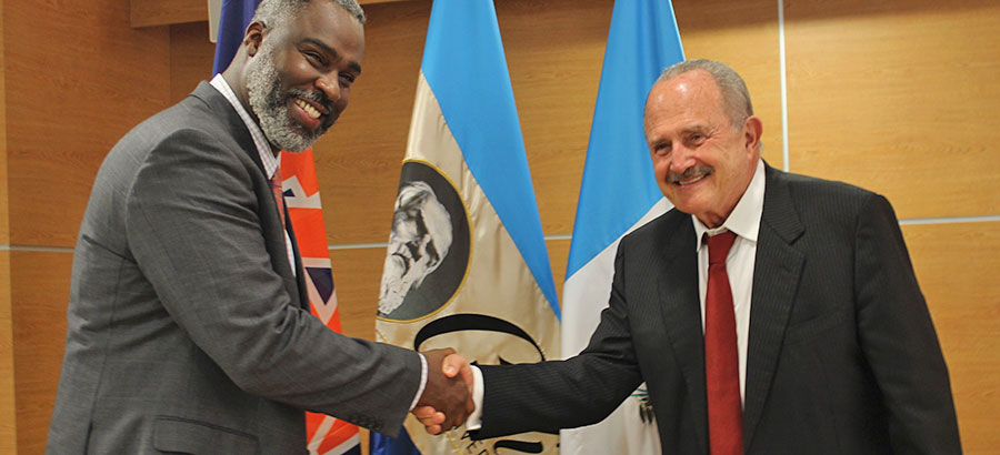 Dr. Royrickers Cook, VP for University Outreach at Auburn University, and Dr. Eduardo Suger, founder and Rector of Galileo University shaking hands
