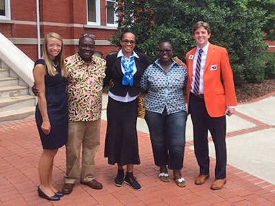 Group of AU and International students pose in front of Samford Hall