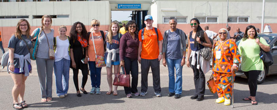 group of people getting ready for a trip pose for a picture