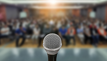 microphone audience blurred in the background