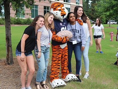 group photo on campus with aubie the tiger mascot