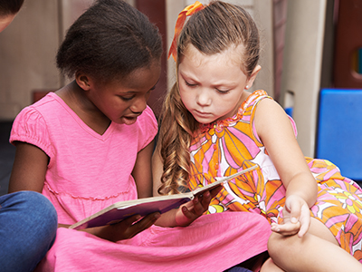 two children reading together