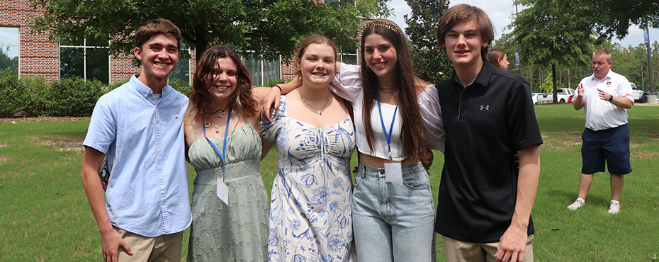 Campers smile for a photo after visiting with the Southeastern Raptor Center.