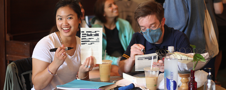 Instructors posing with pages