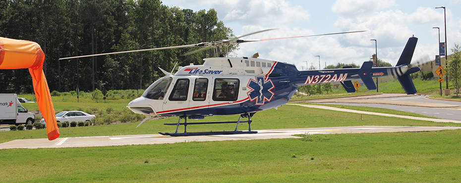 Helicopter landing on pad