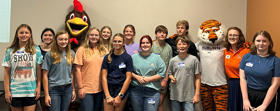 Campers posing with Aubie the Tiger AU Mascot and The Chicken Mascot