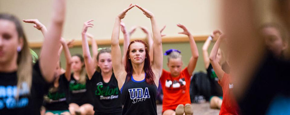 A Universal Dance Association staff member leads her group of dancers.