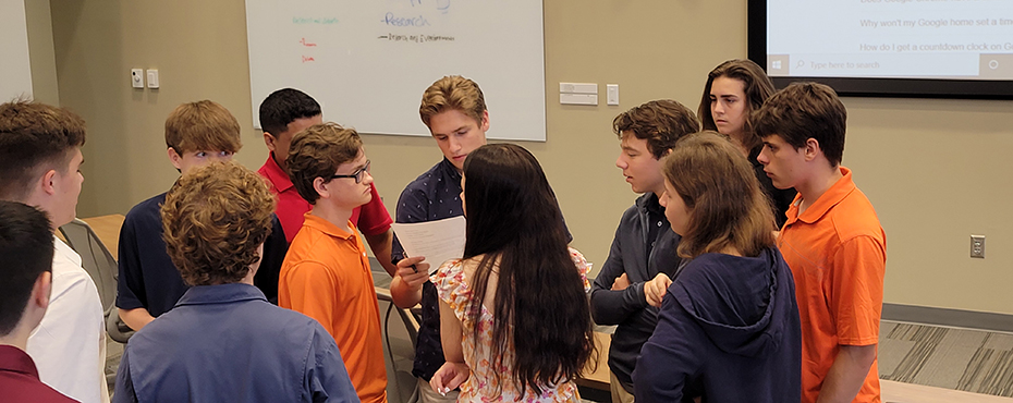Students gathered to read a memo