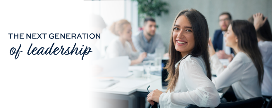 Woman smiling at conference table with a group of professionals