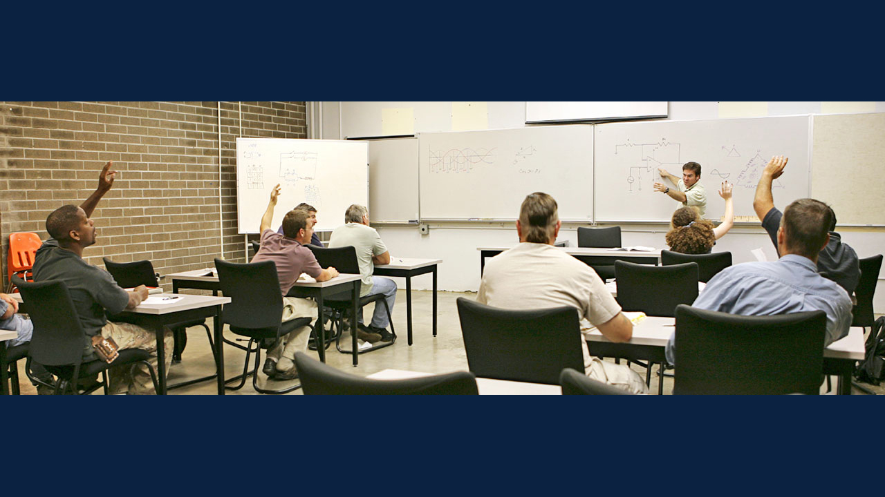 Students in a classroom during an electrical class.