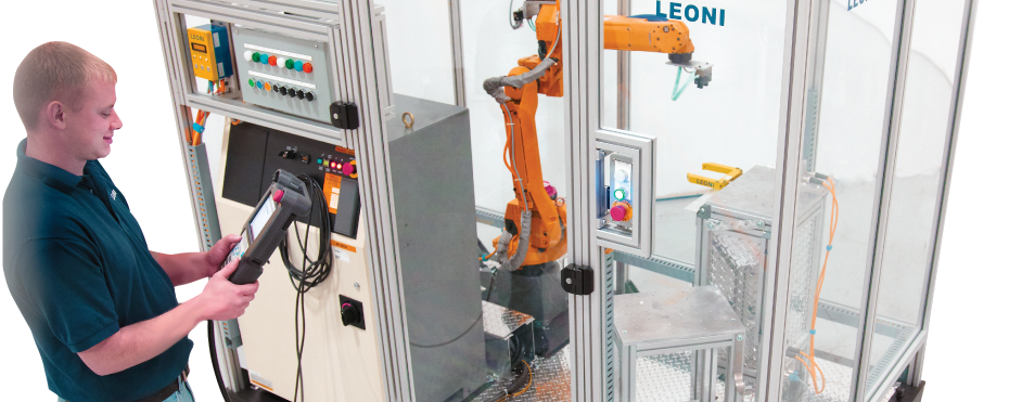 Man using a remote to run diagnostics on a robot