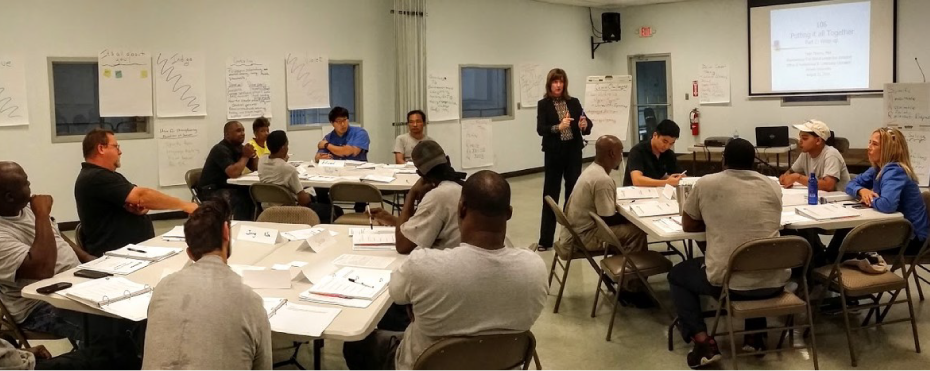 training participants listening to a presentation