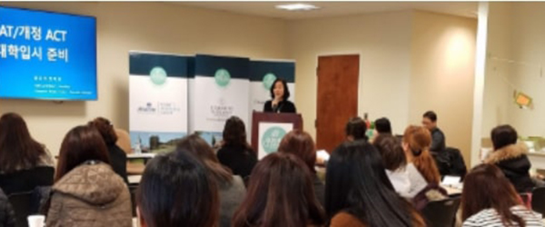 people in a classroom listening to a lecture