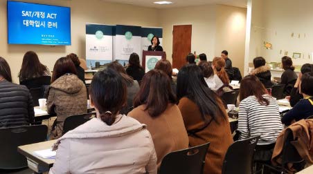 people sitting at desks listening to a lecture