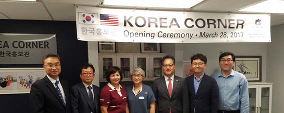 7 people in front of a sign