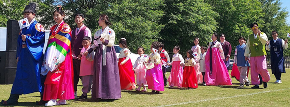 people in a parade wearing traditional costumes