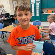 Student making Songpyeon with playdoh