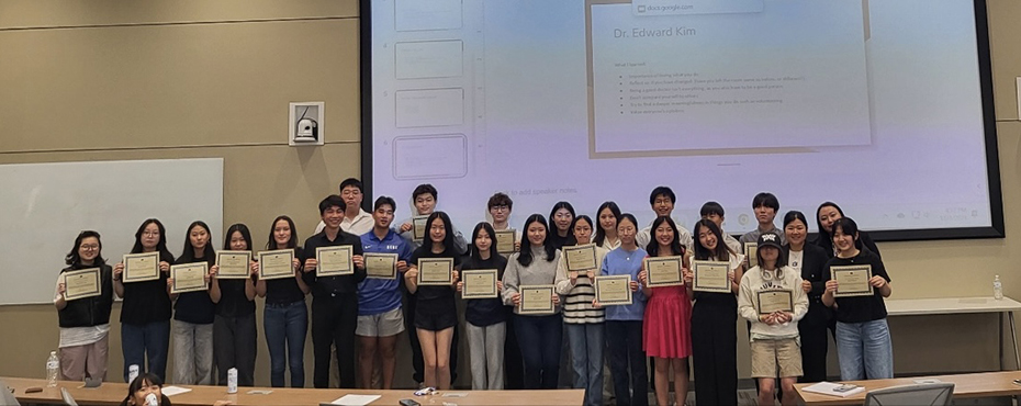Group of students standing in front of a doorway