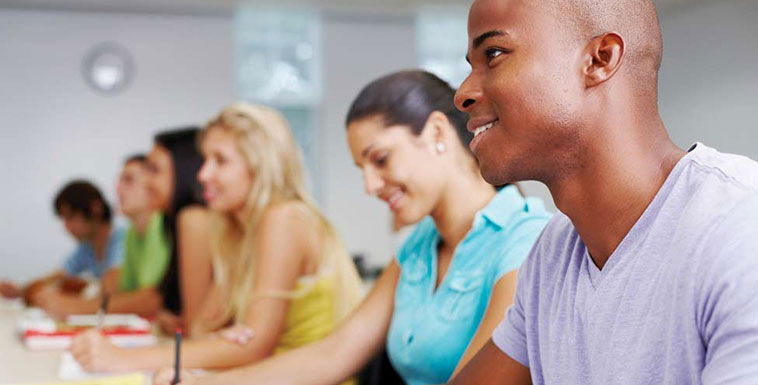 Students taking notes during a class