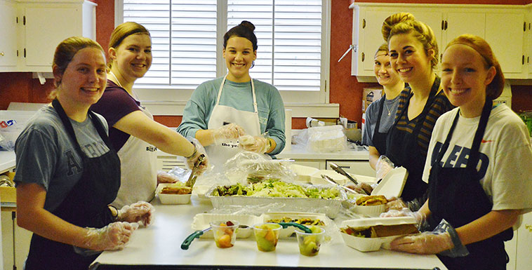Group of volunteers re-packing food