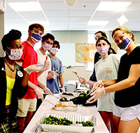 Campus Kitchen members packaging food