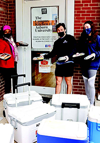 Campus Kitchen members delivering food